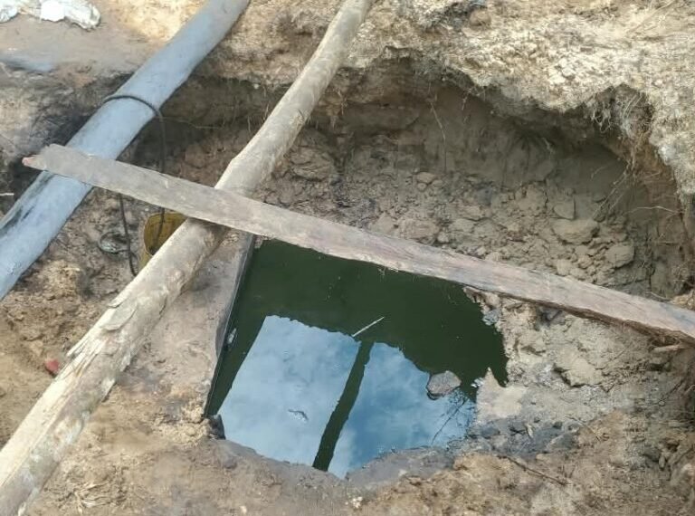 Dugout reservoir containing suspected stolen crude oil found during a Nigerian Navy operation in Delta State.