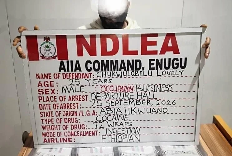 NDLEA arrest photo showing suspect board for 72 cocaine wraps at Enugu airport