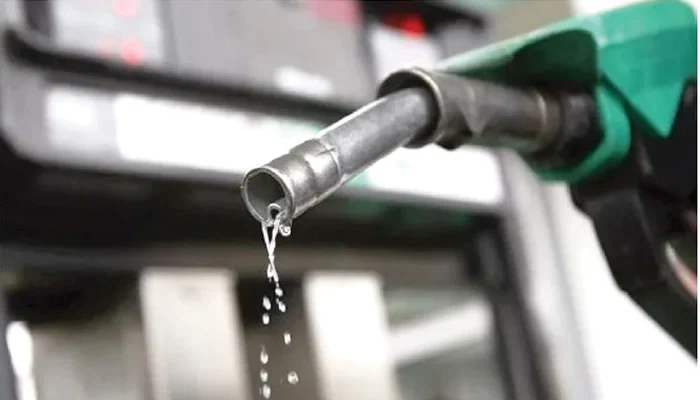 Petrol dispensing nozzle at a filling station, illustrating the downstream petroleum market