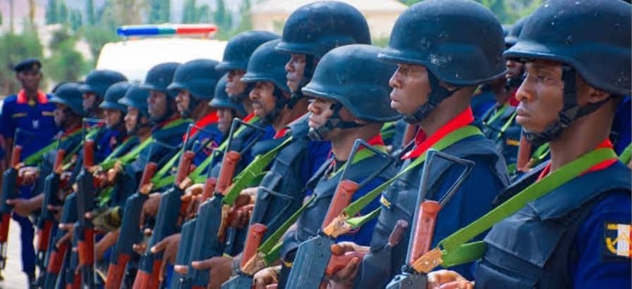 Uniformed NSCDC personnel standing in formation