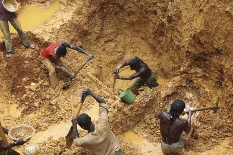 Sand miners working at an excavation site