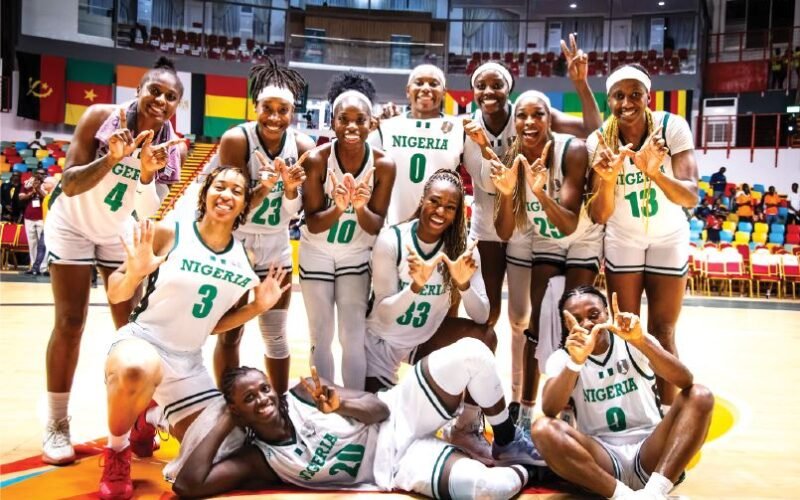 D’Tigress players in Nigeria basketball jerseys posing together