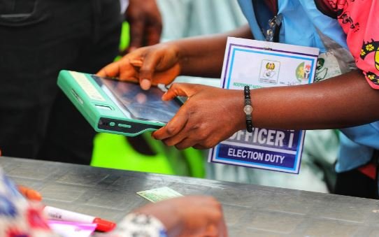 Election official using a BVAS device