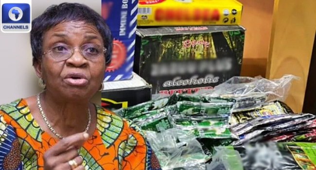 NAFDAC Director-General Mojisola Adeyeye beside sachet alcohol products in a Channels Television image