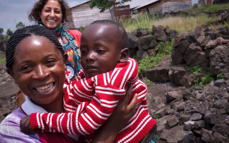 A woman holds a child in an official ICRC Nigeria family-links photo