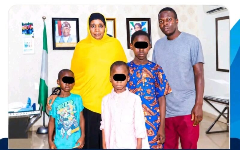 NAPTIP Director-General Binta Bello with rescued children whose faces are obscured