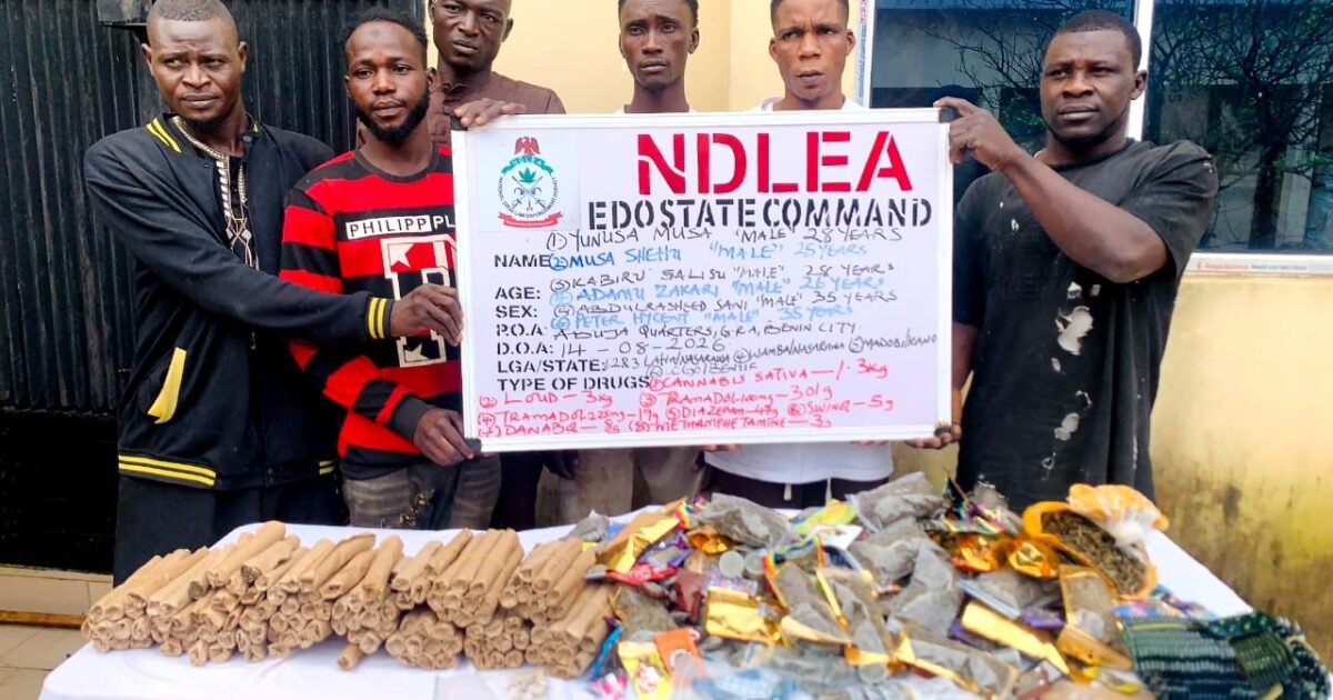 Suspected traffickers with seized drugs and an NDLEA Edo State Command board in Edo