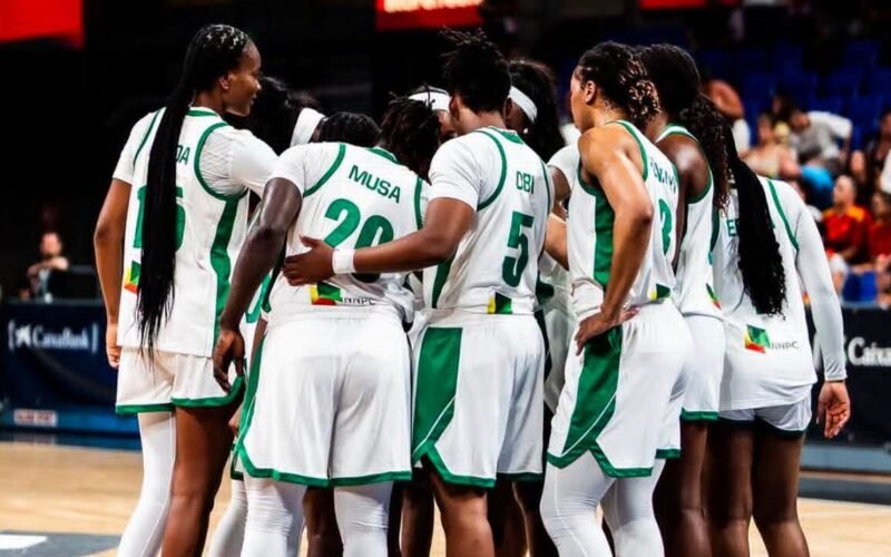 Nigeria’s D’Tigress players in a huddle during a basketball game.