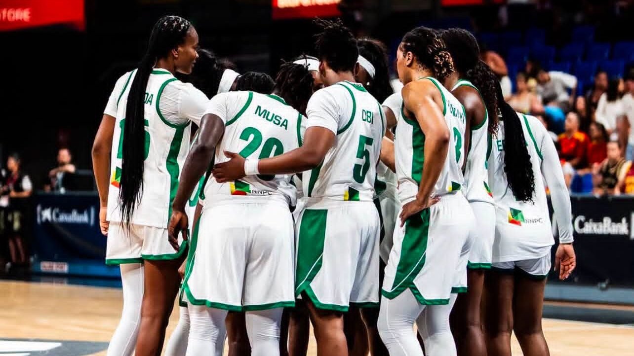 Nigeria’s D’Tigress players in a huddle during a basketball game.
