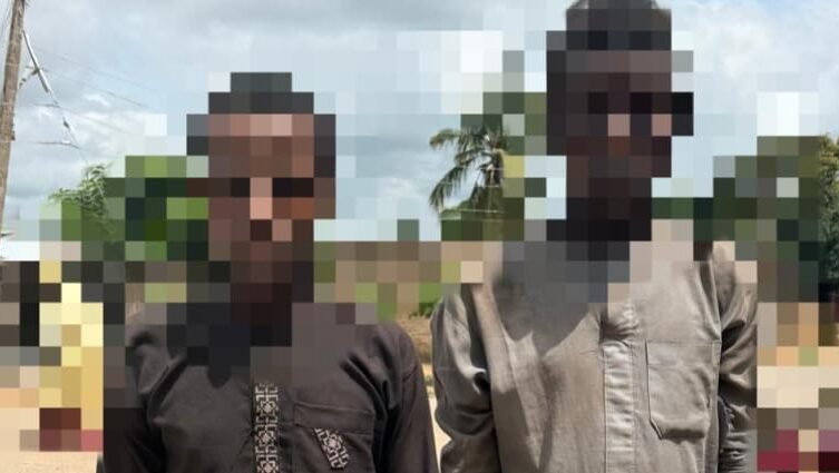 Two blurred suspected kidnappers linked to a Niger police rescue operation