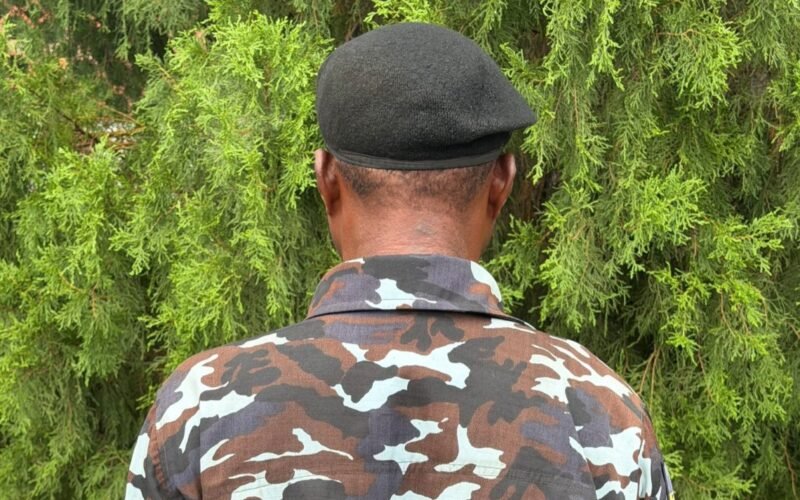Inspector Osumah Frank photographed from behind in police uniform