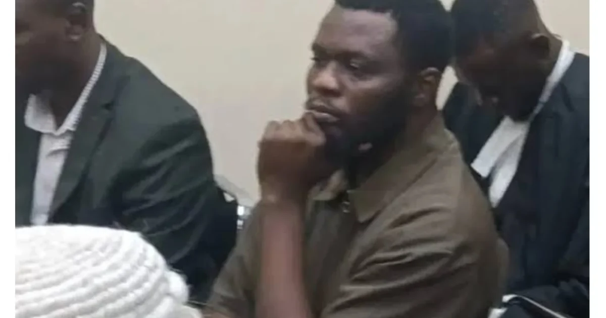 Man seated among lawyers in Daily Post's photograph accompanying the JAMB impersonation bail report