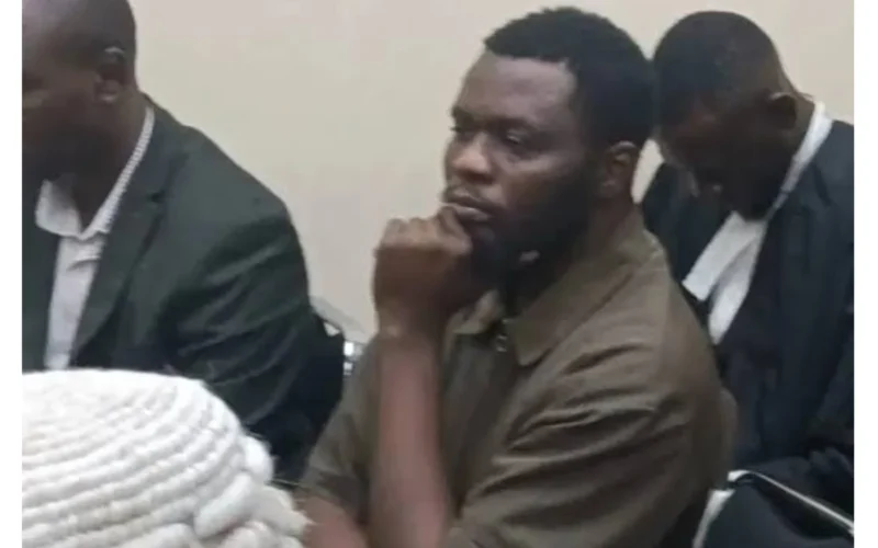 Man seated among lawyers in Daily Post's photograph accompanying the JAMB impersonation bail report