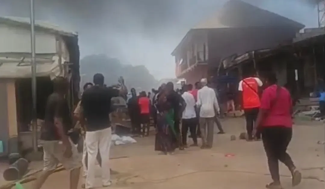 Smoke rising over shops at Kugbo furniture market in Abuja