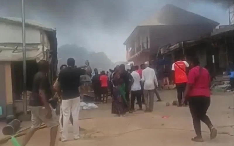 Smoke rising over shops at Kugbo furniture market in Abuja