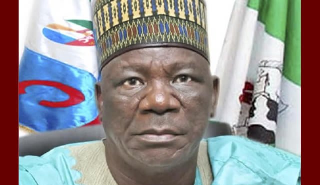 Portrait of Gombe Deputy Governor Manassah Jatau wearing a patterned cap
