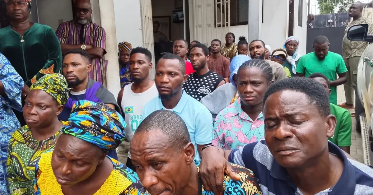 Relatives of abducted prospective corps members gathered outside a residence in Ibadan