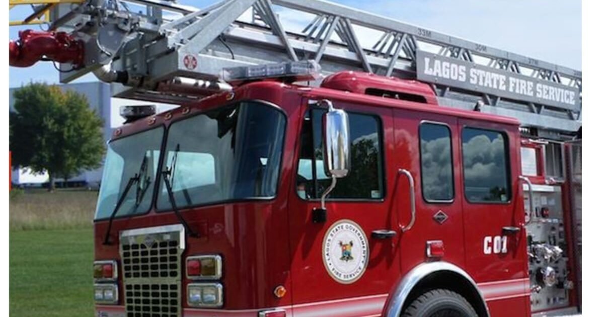Contextual photograph of a red ladder fire engine bearing Lagos State Fire Service markings.
