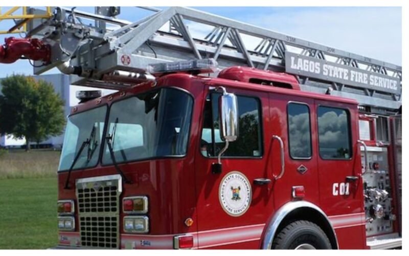 Contextual photograph of a red ladder fire engine bearing Lagos State Fire Service markings.