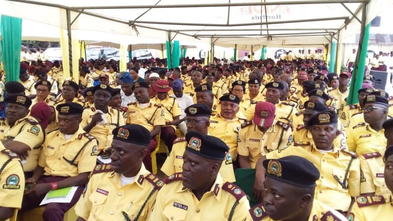 LASTMA officials in yellow uniforms seated under a canopy at an official event in Lagos