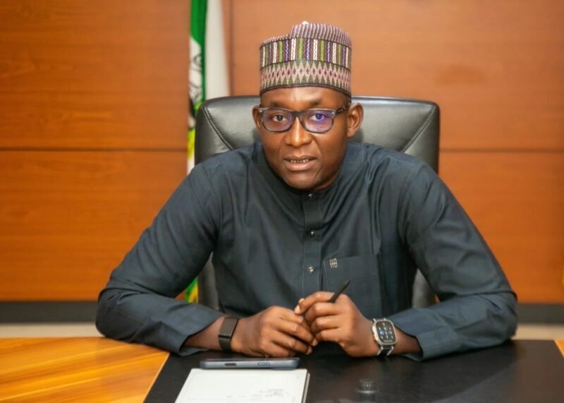 The Chief Executive of the Nigerian Midstream and Downstream Petroleum Regulatory Authority seated at his desk.